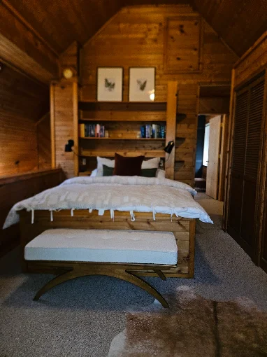 Freshly cleaned cabin bedroom with crisp white bedding by Kingdom Path in Fountain, Michigan